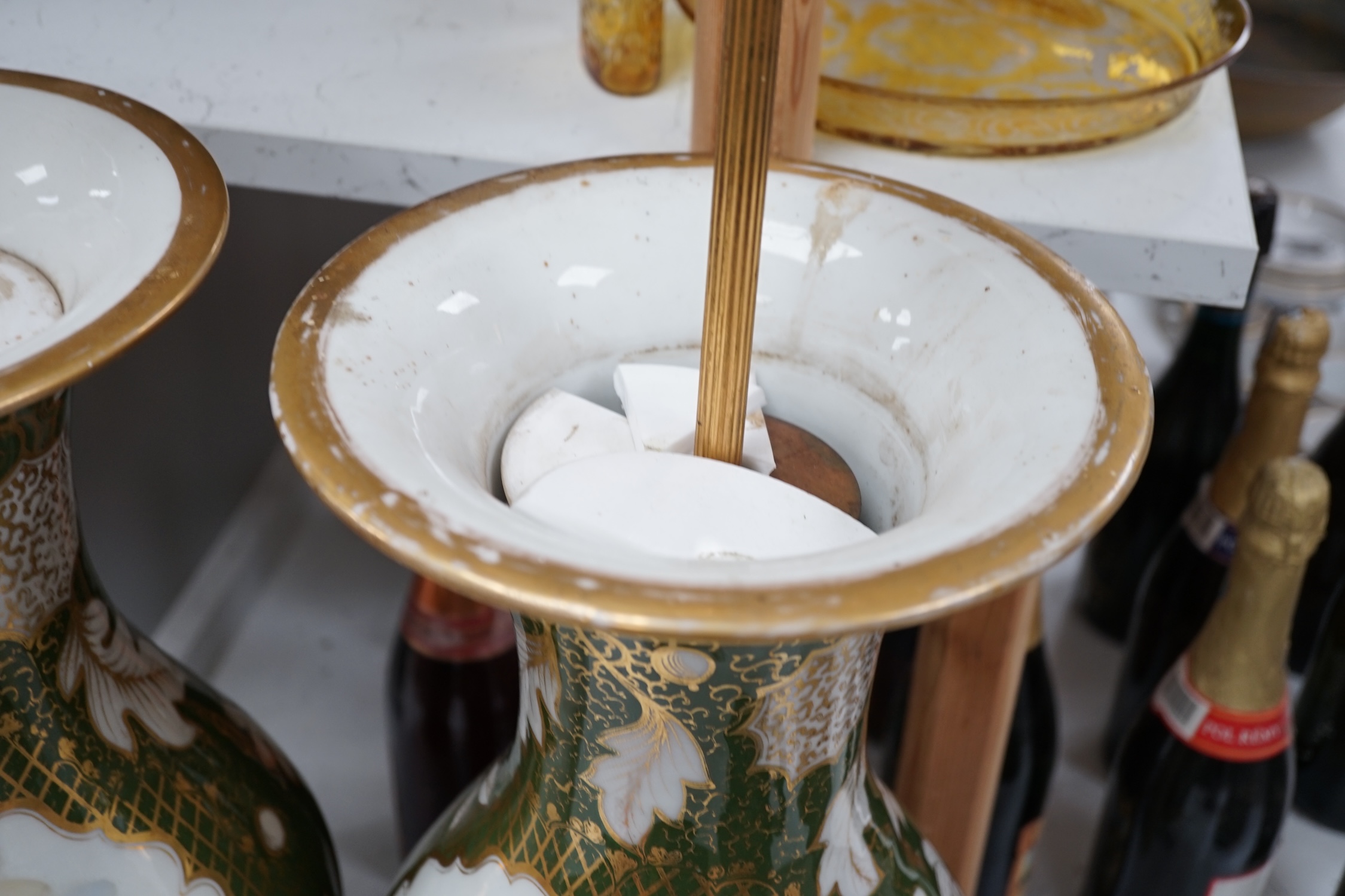 A large pair of Continental porcelain vases converted to lamps, painted with figures before landscapes, 51cm high excluding the fitting. Condition - fair to good. Untested.